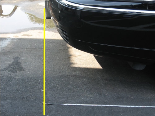 Line up front of measuring tape with front of limo